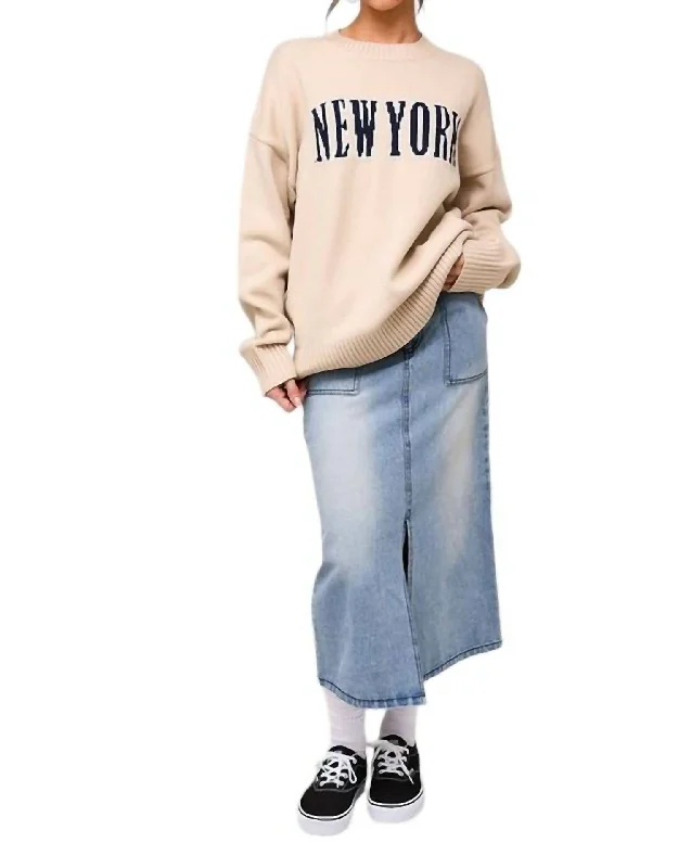 Plus Size Women's Belted Cable Knit SweatersNew York Graphic Sweater In Cream