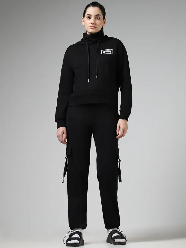 Women's unisex - style casual pants Ripped women jeans for a rebellious and fashion - forward style Studiofit Black Embroidered Cotton Blend Hoodie With Mask Women's unisex - style casual pants Ripped women jeans for a rebellious and fashion - forward style Studiofit Black Embroidered Cotton Blend Hoodie With Mask
