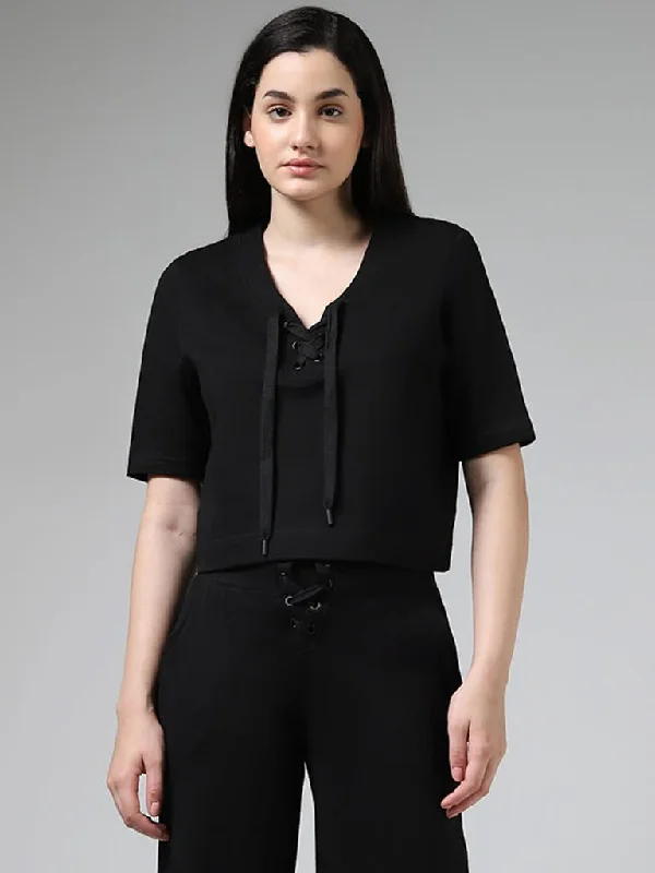 Women's pants with wrinkle - resistant material Cargo women jeans with multiple pockets for added functionality Superstar Solid Black Cotton Lace-Up T-Shirt Women's pants with wrinkle - resistant material Cargo women jeans with multiple pockets for added functionality Superstar Solid Black Cotton Lace-Up T-Shirt