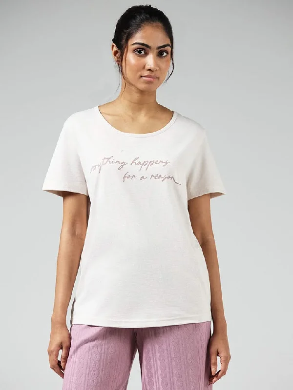 Women's hand - made artisanal pants Acid - wash women jeans with a retro finish Wunderlove Beige Typographic Printed Cotton Blend T-Shirt