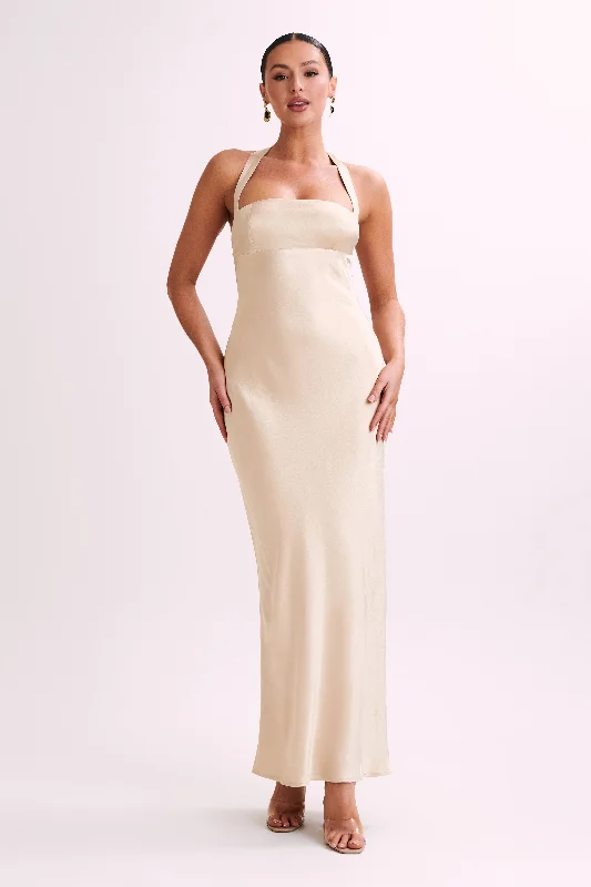 Maxi dresses with geometric prints for a contemporary aestheticSabra Satin Halter Maxi Dress - Gold Maxi dresses with geometric prints for a contemporary aestheticSabra Satin Halter Maxi Dress - Gold
