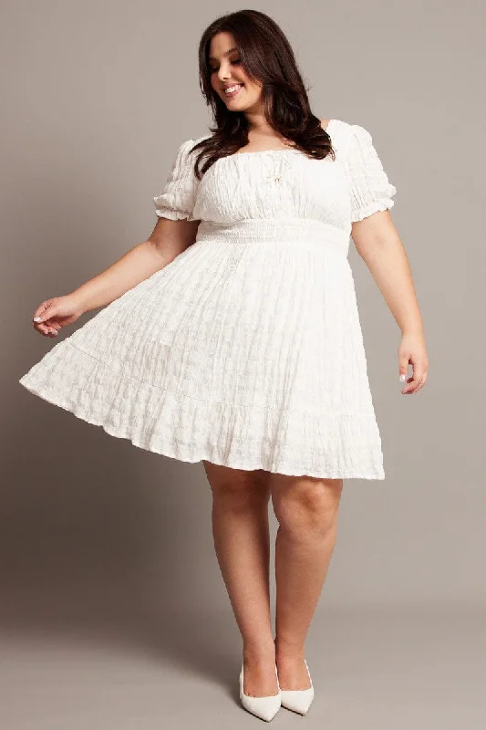 Linen mini dresses for a breathable summer optionWhite Textured Check Cotton Blend Shirred Waist Mini Dress Linen mini dresses for a breathable summer optionWhite Textured Check Cotton Blend Shirred Waist Mini Dress